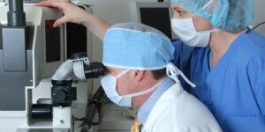 an ophthalmologist and his assistant performing lasik surgery